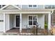 Charming front porch with chairs, lamp, and a view of the front yard at 8816 Knights Union Way, Wake Forest, NC 27587