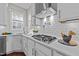 Modern kitchen featuring white cabinetry, subway tile backsplash, and stainless steel appliances at 8816 Knights Union Way, Wake Forest, NC 27587