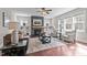 Cozy living room with a fireplace, built-in shelves, plush seating, and natural light at 8816 Knights Union Way, Wake Forest, NC 27587