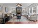 Inviting living room featuring a fireplace with decor, built-in shelving, and comfortable seating at 8816 Knights Union Way, Wake Forest, NC 27587