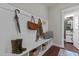 Functional mudroom with built-in bench, coat hooks, and storage cubbies at 8816 Knights Union Way, Wake Forest, NC 27587