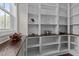 Spacious pantry with custom built-in shelving and wood countertop, perfect for storage at 8816 Knights Union Way, Wake Forest, NC 27587