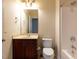 Bathroom with a single sink vanity, toilet, and shower-tub combo at 9221 Calabria Dr # 121, Raleigh, NC 27617