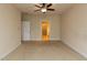 Neutral bedroom with carpeting, ceiling fan, and doorway to a closet at 9221 Calabria Dr # 121, Raleigh, NC 27617