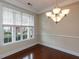 Bright dining room with chandelier and large window at 9221 Calabria Dr # 121, Raleigh, NC 27617