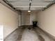 Spacious two-car garage with overhead lighting and ample storage shelving at 9221 Calabria Dr # 121, Raleigh, NC 27617