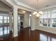 Open-concept living room with hardwood floors and ample natural light at 9221 Calabria Dr # 121, Raleigh, NC 27617