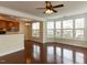 Open-concept living room with hardwood floors and modern kitchen at 9221 Calabria Dr # 121, Raleigh, NC 27617