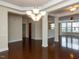 Spacious living area with hardwood floors and elegant lighting at 9221 Calabria Dr # 121, Raleigh, NC 27617
