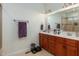 Bathroom with double sink vanity and a large framed mirror at 100 Lexington Ave, Zebulon, NC 27597