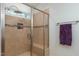 Bathroom featuring tiled glass shower with built-in bench at 100 Lexington Ave, Zebulon, NC 27597