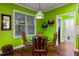 Bright breakfast nook featuring colorful walls, glass table, and designer lighting at 100 Lexington Ave, Zebulon, NC 27597