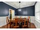 Dining room featuring a wooden table, stylish lighting, and contemporary decor at 100 Lexington Ave, Zebulon, NC 27597