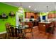Well lit kitchen area featuring wooden cabinets, an island with barstool seating, and stainless steel appliances at 100 Lexington Ave, Zebulon, NC 27597