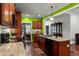 Spacious kitchen with wooden cabinetry, granite counters, stainless appliances, and an eat-in dining area at 100 Lexington Ave, Zebulon, NC 27597