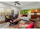 Open concept living space with hardwood floors, including the kitchen and a cozy living area with sofas at 100 Lexington Ave, Zebulon, NC 27597