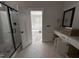 Bathroom with a glass shower and double vanity, featuring decorative tile at 100 Spumante Ct, Princeton, NC 27569