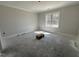 Bedroom with a large window providing natural light at 100 Spumante Ct, Princeton, NC 27569