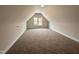Versatile bonus room with natural light and neutral carpet at 100 Spumante Ct, Princeton, NC 27569