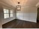 Well-lit dining room featuring wainscoting and wood floors at 100 Spumante Ct, Princeton, NC 27569