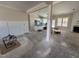 Open-concept living room with ample natural light, fireplace, and access to the kitchen at 100 Spumante Ct, Princeton, NC 27569
