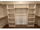 Organized walk-in closet with custom shelving and ample storage space at 100 Spumante Ct, Princeton, NC 27569