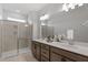 Elegant bathroom featuring a double sink vanity, a frameless glass shower, and modern fixtures at 1004 Westerland Way # 197, Durham, NC 27703