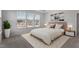 Serene bedroom with a large window, neutral tones, and contemporary decor for a relaxing atmosphere at 1004 Westerland Way # 197, Durham, NC 27703
