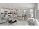 Open-concept living space featuring a kitchen, dining area, and a stylishly furnished living room at 1004 Westerland Way # 197, Durham, NC 27703