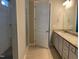 Spacious bathroom with tiled shower, granite countertop vanity and tile floor at 1006 Pondfield Way, Durham, NC 27713