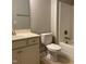 Bathroom with toilet, tub and vanity sink at 1006 Pondfield Way, Durham, NC 27713