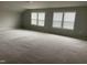 Spacious bonus room with carpeting and multiple windows at 1006 Pondfield Way, Durham, NC 27713