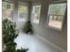 Cozy sunroom with tile floors and lots of natural light from multiple windows at 1006 Pondfield Way, Durham, NC 27713