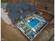 Aerial view of a home with a pool, manicured garden, outdoor seating and dining area at 1012 Casa Dega Way, Raleigh, NC 27613