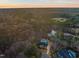Home with swimming pool surrounded by landscaping, outdoor furniture, and manicured garden at 1012 Casa Dega Way, Raleigh, NC 27613