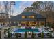Expansive backyard showcasing a luxurious pool, lounge areas, and lush landscaping, perfect for relaxation at 1012 Casa Dega Way, Raleigh, NC 27613