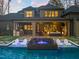 Charming backyard with a pool, spa, and patio seating, perfect for enjoying outdoor living at 1012 Casa Dega Way, Raleigh, NC 27613
