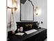 Bathroom featuring gold fixtures and black marble countertop at 1012 Casa Dega Way, Raleigh, NC 27613