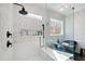 Modern bathroom boasts a frameless glass shower with a built-in bench and a luxurious soaking tub at 1012 Casa Dega Way, Raleigh, NC 27613
