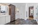 This renovated bathroom features a dark bathtub, sleek countertops, tile floors, and a large glass shower at 1012 Casa Dega Way, Raleigh, NC 27613