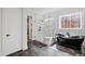 Stunning bathroom features a glass shower with a soaking tub, and a doorway to a custom closet at 1012 Casa Dega Way, Raleigh, NC 27613