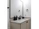 Bathroom vanity featuring marble countertop and black hardware and fixtures at 1012 Casa Dega Way, Raleigh, NC 27613