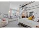 Light-filled bedroom featuring a canopy bed, window seat, and carpet flooring at 1012 Casa Dega Way, Raleigh, NC 27613