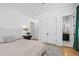 Stylish bedroom featuring hardwood floors, a white bed, and neutral decor with great natural light at 1012 Casa Dega Way, Raleigh, NC 27613