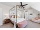 Charming bedroom features a canopy bed, ceiling fan, and cozy decor at 1012 Casa Dega Way, Raleigh, NC 27613