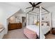 Cozy bedroom featuring a canopy bed, sloped ceiling, neutral decor, and carpet flooring at 1012 Casa Dega Way, Raleigh, NC 27613