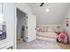 This bedroom showcases a sloped ceiling and decor for a cozy feel at 1012 Casa Dega Way, Raleigh, NC 27613