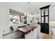 Eat-in kitchen dining nook with window bench and view of the backyard patio at 1012 Casa Dega Way, Raleigh, NC 27613