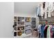 Walk-in closet featuring built-in shelving, storage baskets, and clothing rods at 1012 Casa Dega Way, Raleigh, NC 27613