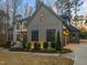 Charming home featuring a two-car garage, manicured shrubbery, and a stone walkway at 1012 Casa Dega Way, Raleigh, NC 27613